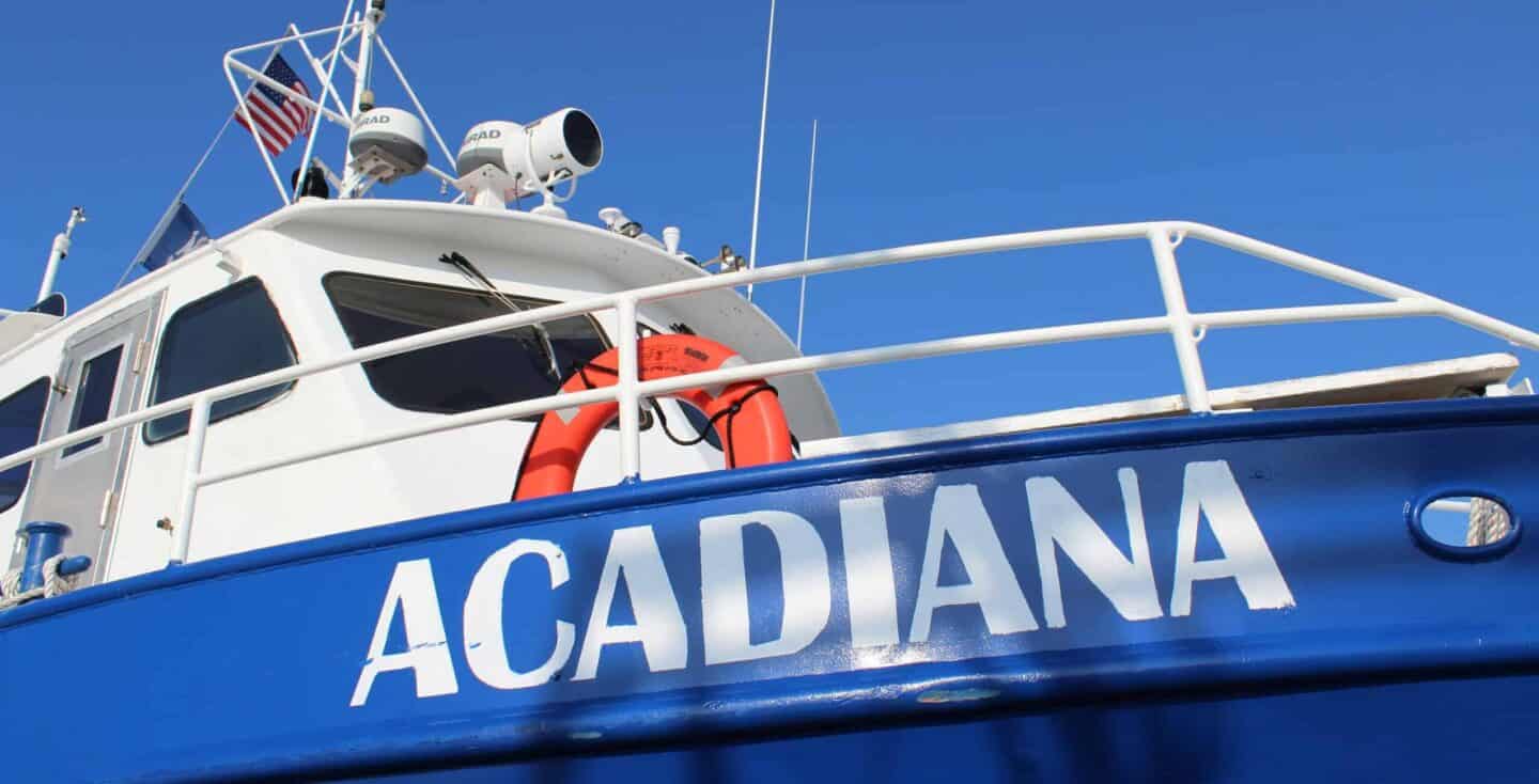 Research vessel Acadia at sea with scientific equipment onboard.